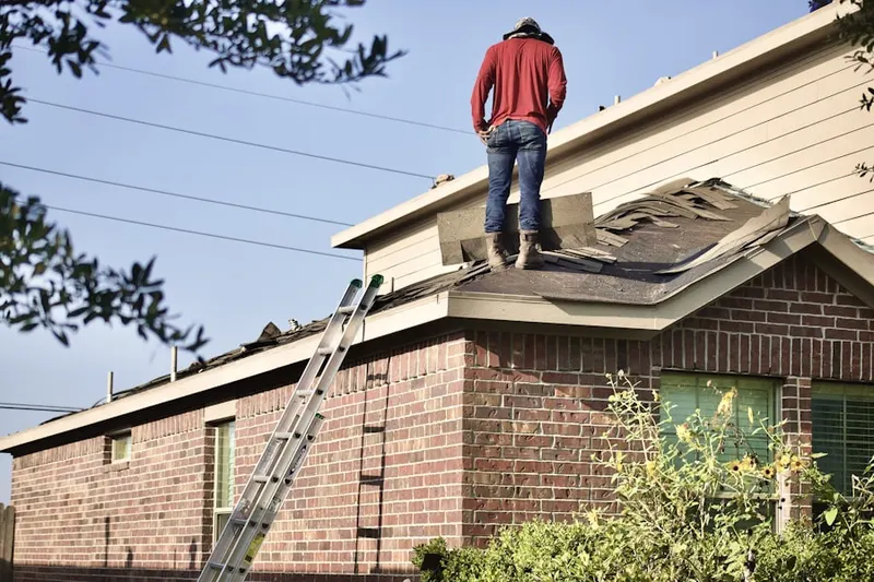 Professional roofer working on a residential roof in LaLoma Ranch